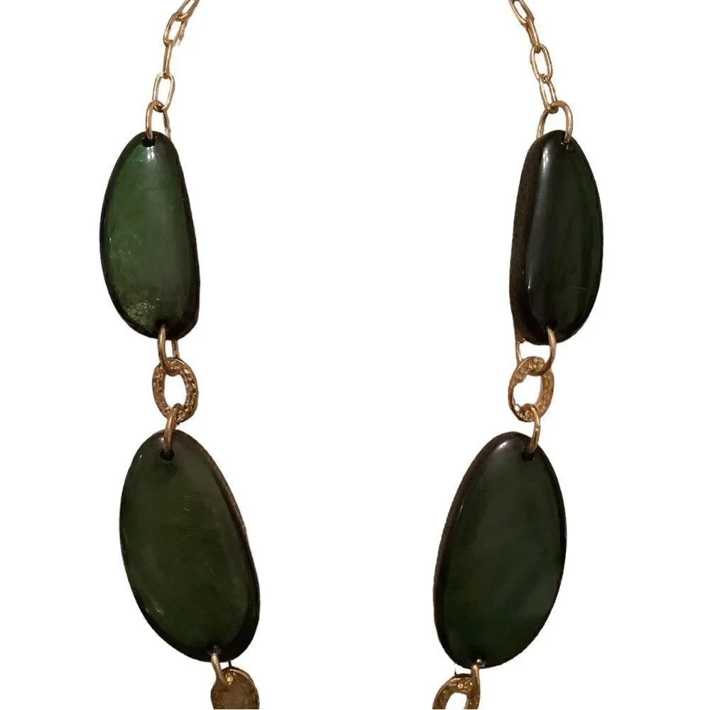 Gold tone necklace with oblong green stones. NWOT